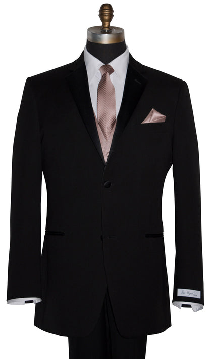 mannequin wearing a black wedding suit with a white dress shirt and a rose-gold tuxedo vest with a rose-gold long necktie with a subtle rose-gold stipe against a white background