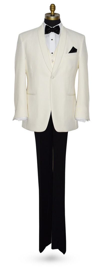 Full length view of an off-white shawl collar tuxedo jacket with black pants, and an off-white vest and black satin bowtie, against a white background