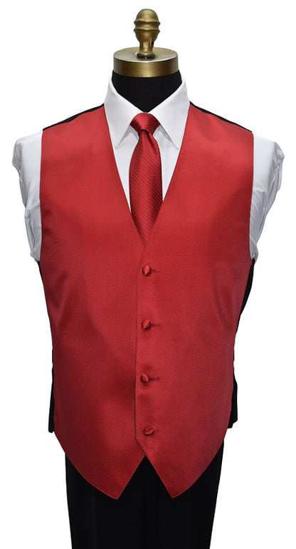 ruby-red tuxedo vest with ruby-red striped necktie on a white shirt against a white background 