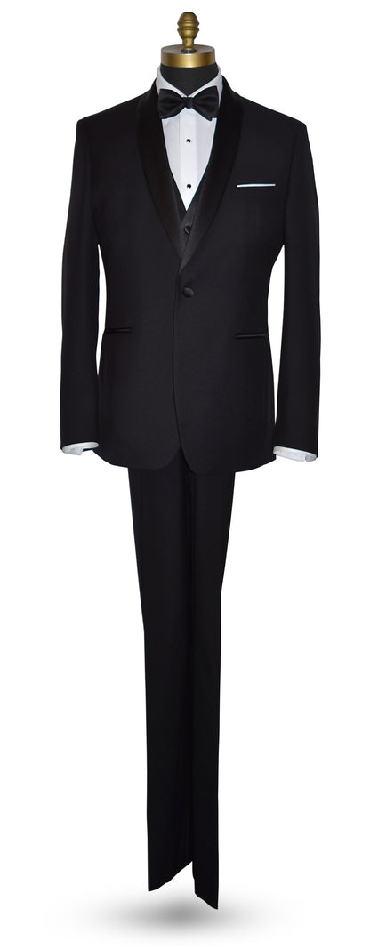 Full length front view of Black shawl collar tuxedo by tuxclub, with white lay-down collar tuxedo shirt and black satin bowtie with a black vest 