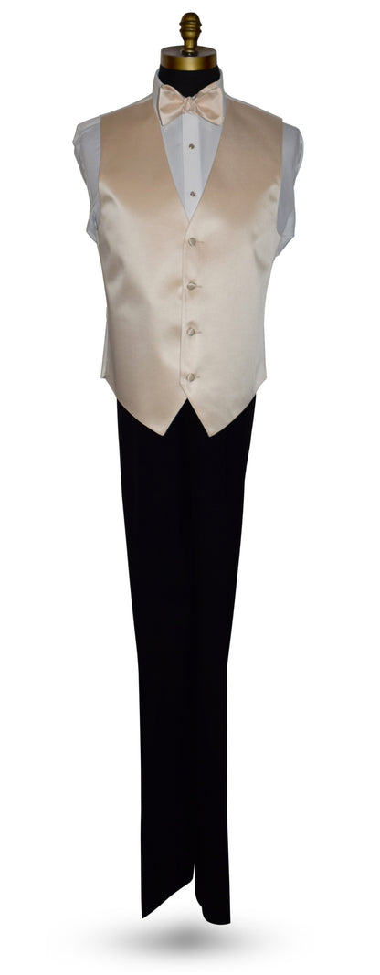 life size mannequin wearing a white dress shirt with a champagne bowtie and champagne tuxedo vest with black tuxedo pants against a white background
