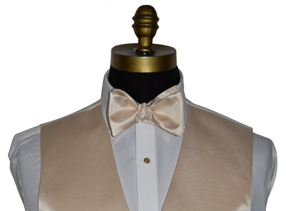 very close up champagne "tie-yourself" bowtie and champagne vest on a mannequin against a white background