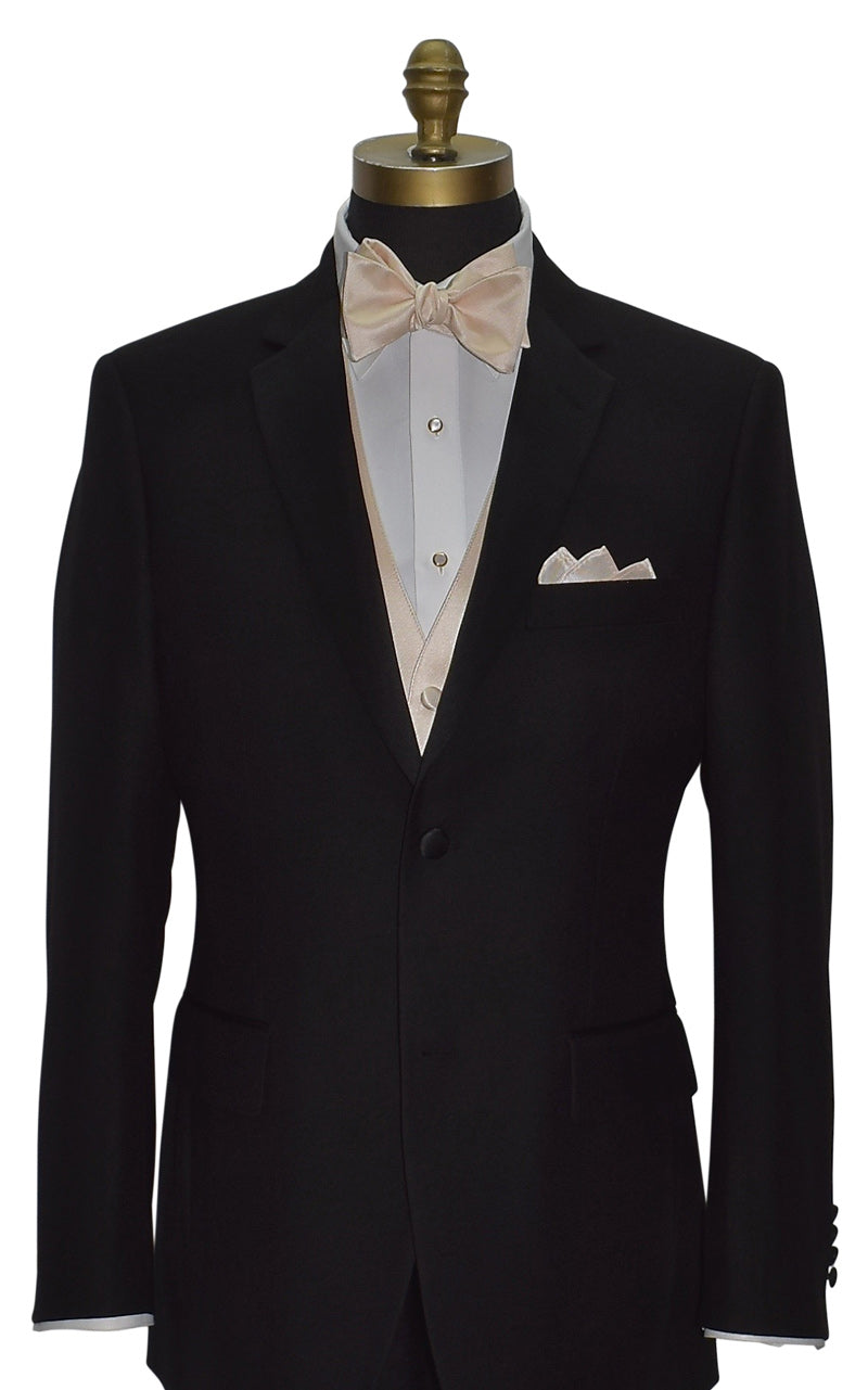 mannequin wearing s black notch-lapel tuxedo with a champagne tuxedo vest and a champagne "tie-yourself"  bow tie against a white background