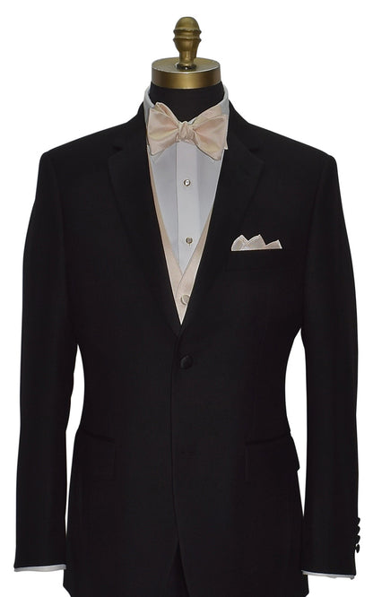mannequin wearing s black notch-lapel tuxedo with a champagne tuxedo vest and a champagne "tie-yourself"  bow tie against a white background