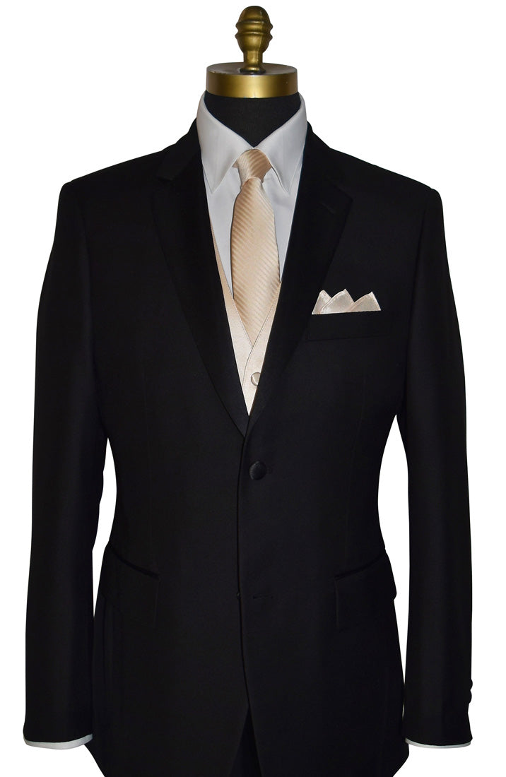 black notch-lapel tuxedo wearing a champagne colored necktie with subtle champagne stripe with a matching champagne pocket handkerchief