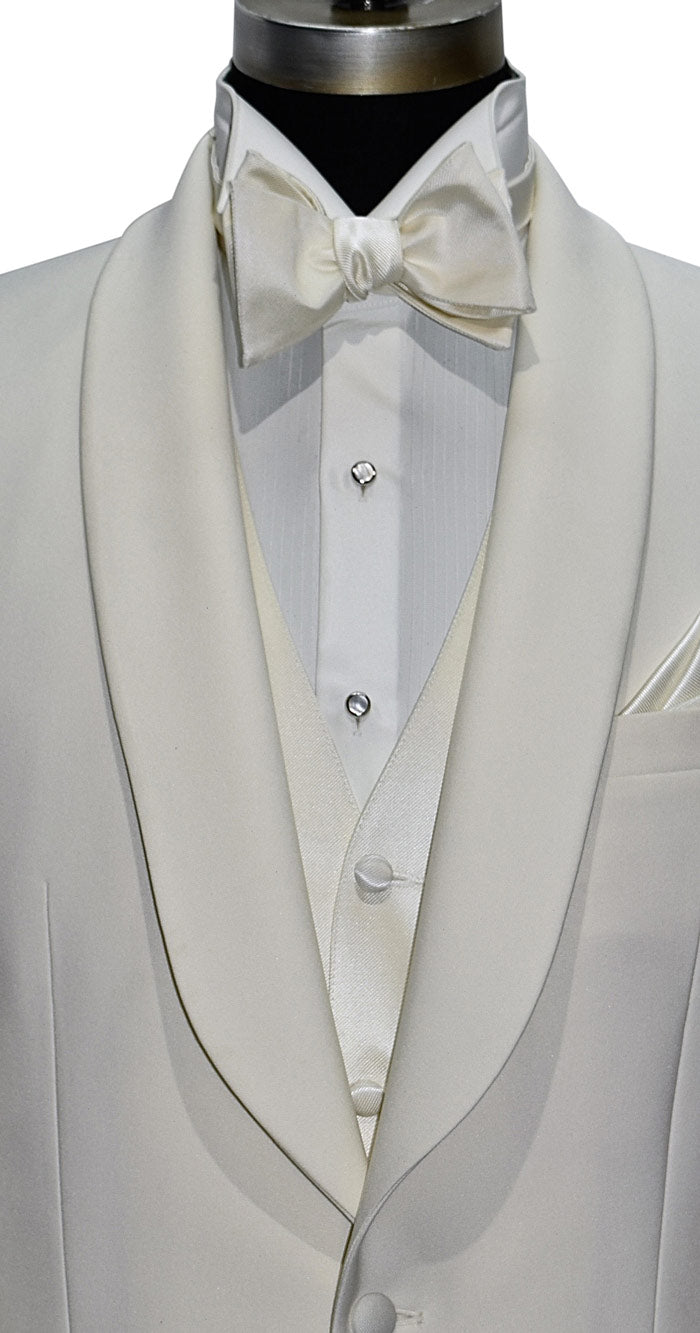 close-up mannequin wearing ivory shawl collar tuxedo with ivory vest and ivory "tie-yourself" bowtie against a white background 