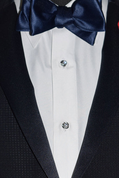 very close-up  midnight-blue tuxedo with a blue-satin tie-yourself bowtie and crystal studs and cufflinks