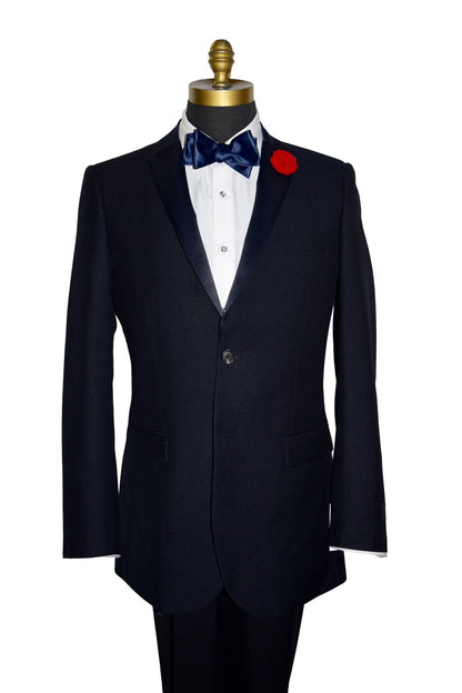 close-up Life size mannequin wearing a navy blue tuxedo jacket with a navy blue satin tie-yourself bowtie.