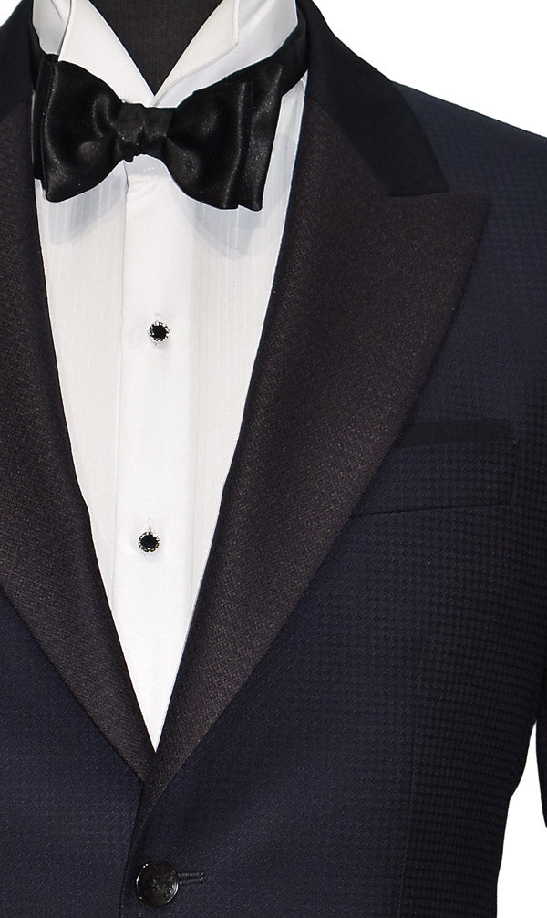 very close-up navy blue peak lapel tuxedo with white shirt with onyx castle-cut formal jewelry and black bow tie
