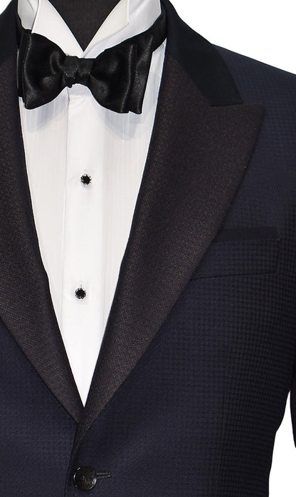 very close-up navy blue peak lapel tuxedo with white shirt with onyx castle-cut formal jewelry and black bow tie
