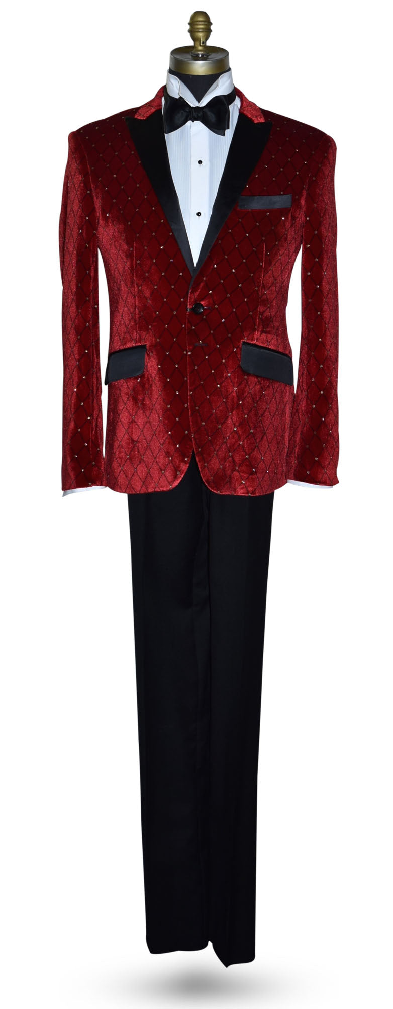 Red velvet tuxedo with black lapels and a white shirt on a mannequin against a white background.