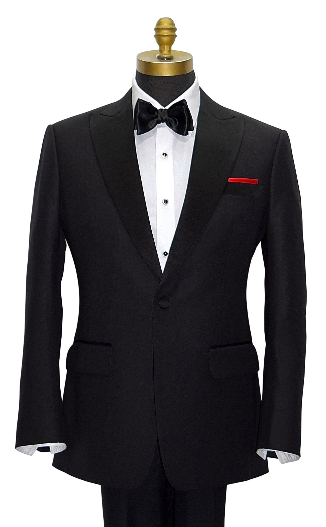 Black peak lapel tuxedo with a black bowtie and a red pocket handkerchief on a mannequin against a white background
