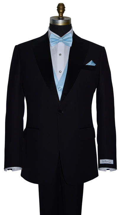 black peak lapel tuxedo with a white tuxedo shirt and a capri-blue bowtie and capri-blue vest with mother-of-pearl-formal jewelry on a mannequin against a white background