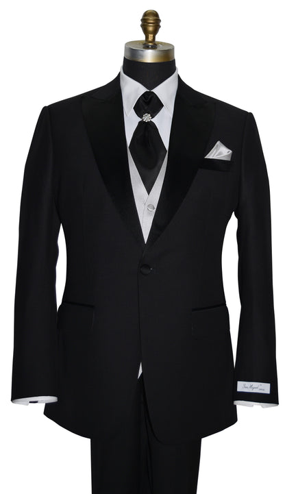 Black peak lapel tuxedo with white shirt and black cravat and gray vest on a mannequin against a white background