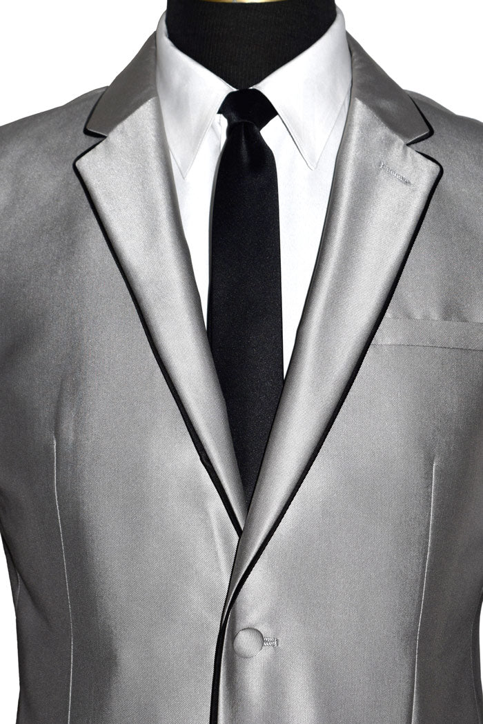 very close-front view mannequin wearing a silver Versace suit coat with black pants and a black necktie against a white background