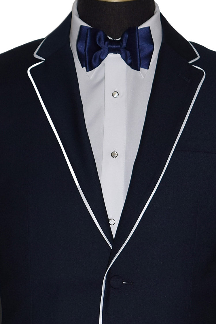 Navy tuxedo with white lapels and a blue bow tie on a mannequin.
