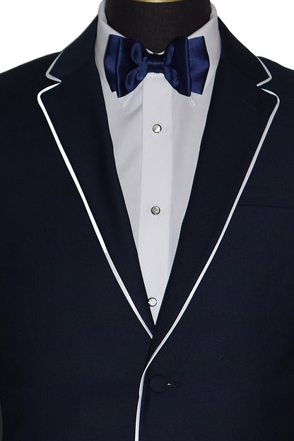 Navy tuxedo with white lapels and a blue bow tie on a mannequin.