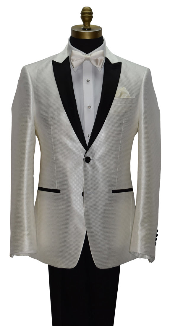 close-up life size mannequin wearing a winter white tuxedo with black lapels wearing an ivory satin bowtie and black tuxedo pants on a mannequin against a white background