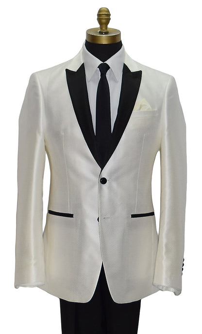 close-up life size mannequin wearing a winter white tuxedo with black lapels wearing a black skinny necktie and black tuxedo pants on a mannequin against a white background