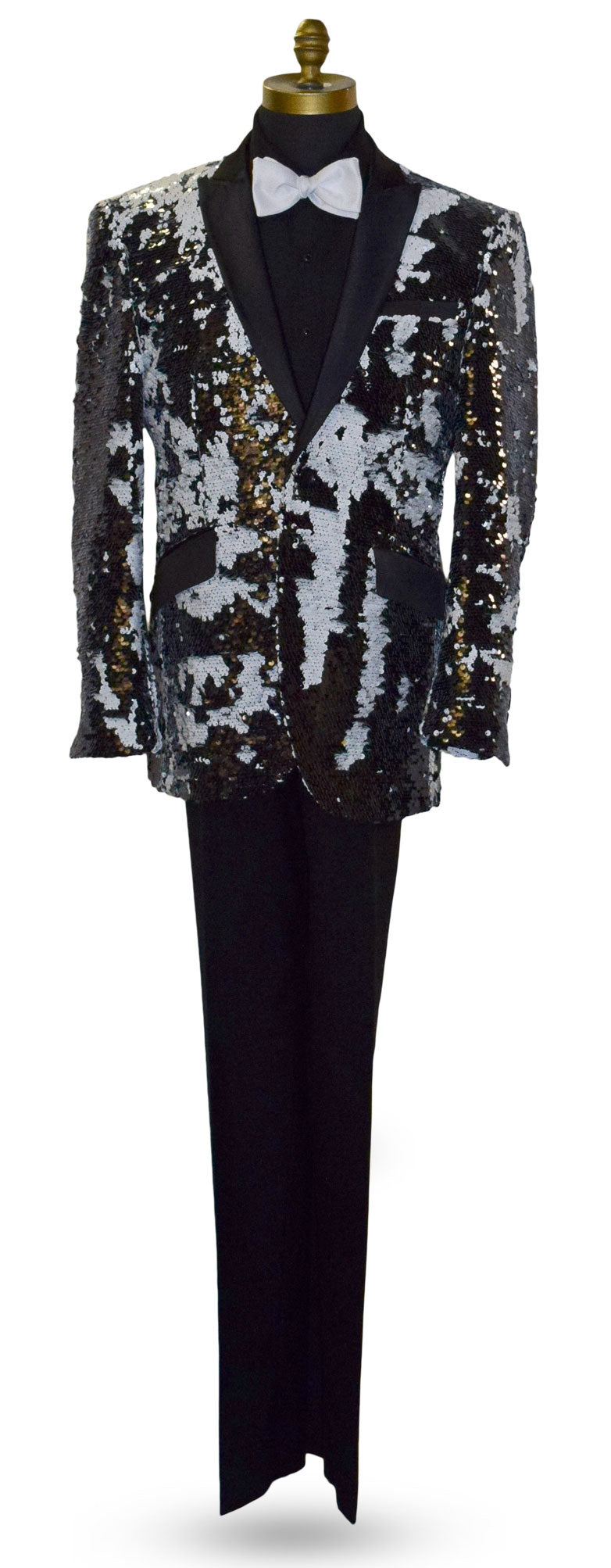 close-up Black and white sequin jacket on a mannequin with a black tuxedo shirt and white bowtie against a white background