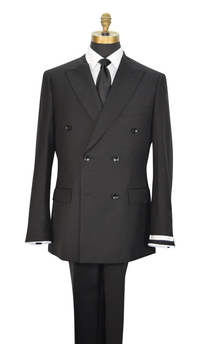 A black double-breasted men's suit displayed on a mannequin torso with a white dress shirt, black necktie, and black trousers. The jacket features peak lapels, six buttons, flap pockets, and super lightweight tropical wool.
