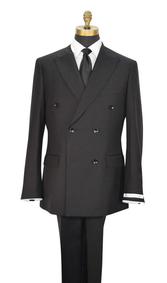 A black double-breasted men's suit displayed on a mannequin torso with a white dress shirt, black necktie, and black trousers. The jacket features peak lapels, six buttons, flap pockets, and super lightweight tropical wool.