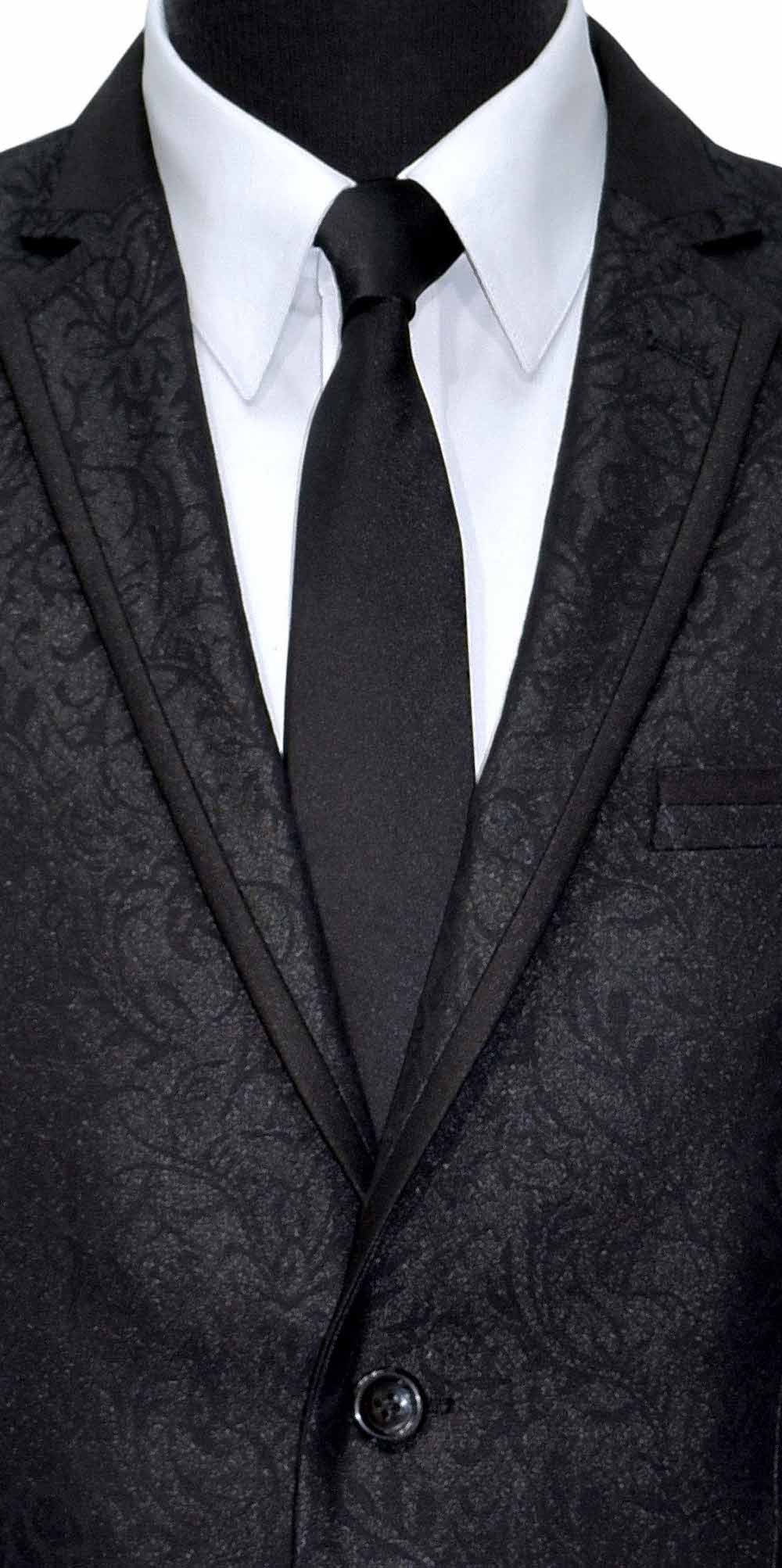 Black patterned suit jacket with a white shirt and black tie on a white background