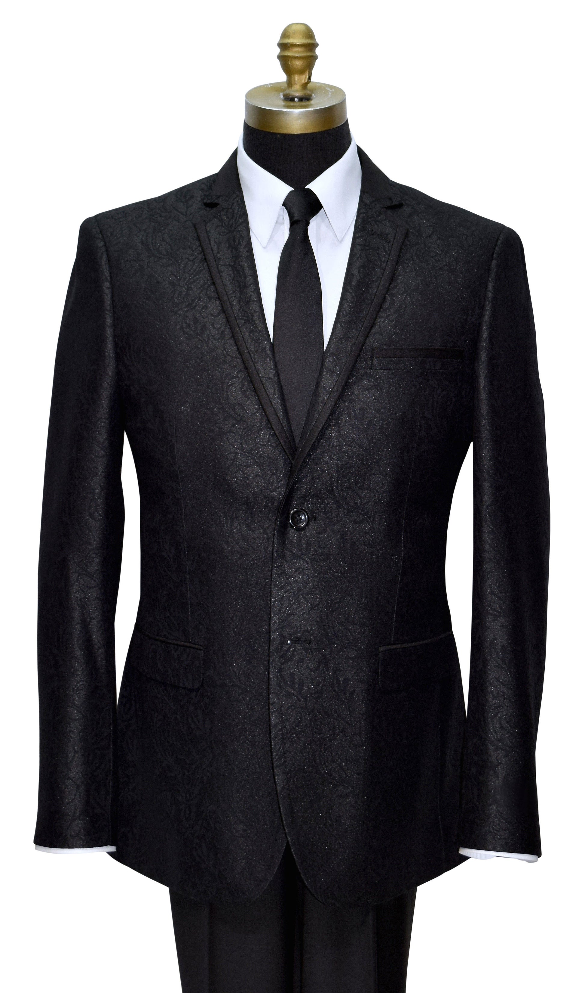 Black brocade notch lapel tuxedo with satin trim on the lapel on a mannequin with a white shirt and black tie against a white background