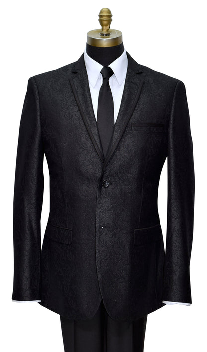 Black brocade notch lapel tuxedo with satin trim on the lapel on a mannequin with a white shirt and black tie against a white background