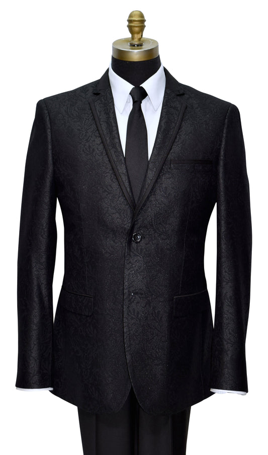 Black brocade notch lapel tuxedo with satin trim on the lapel on a mannequin with a white shirt and black tie against a white background