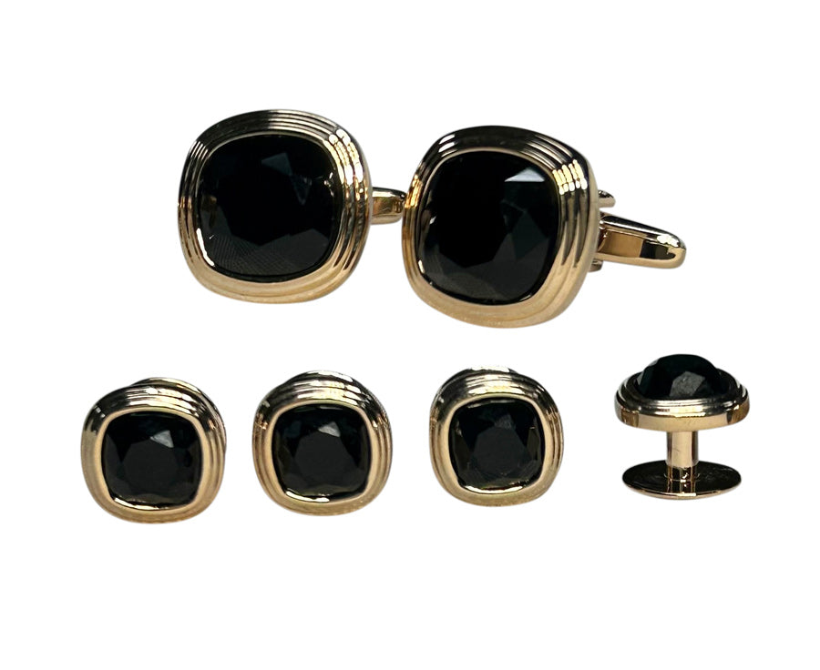 close-up of Cufflink and studs set with black stones and rose-gold setting
