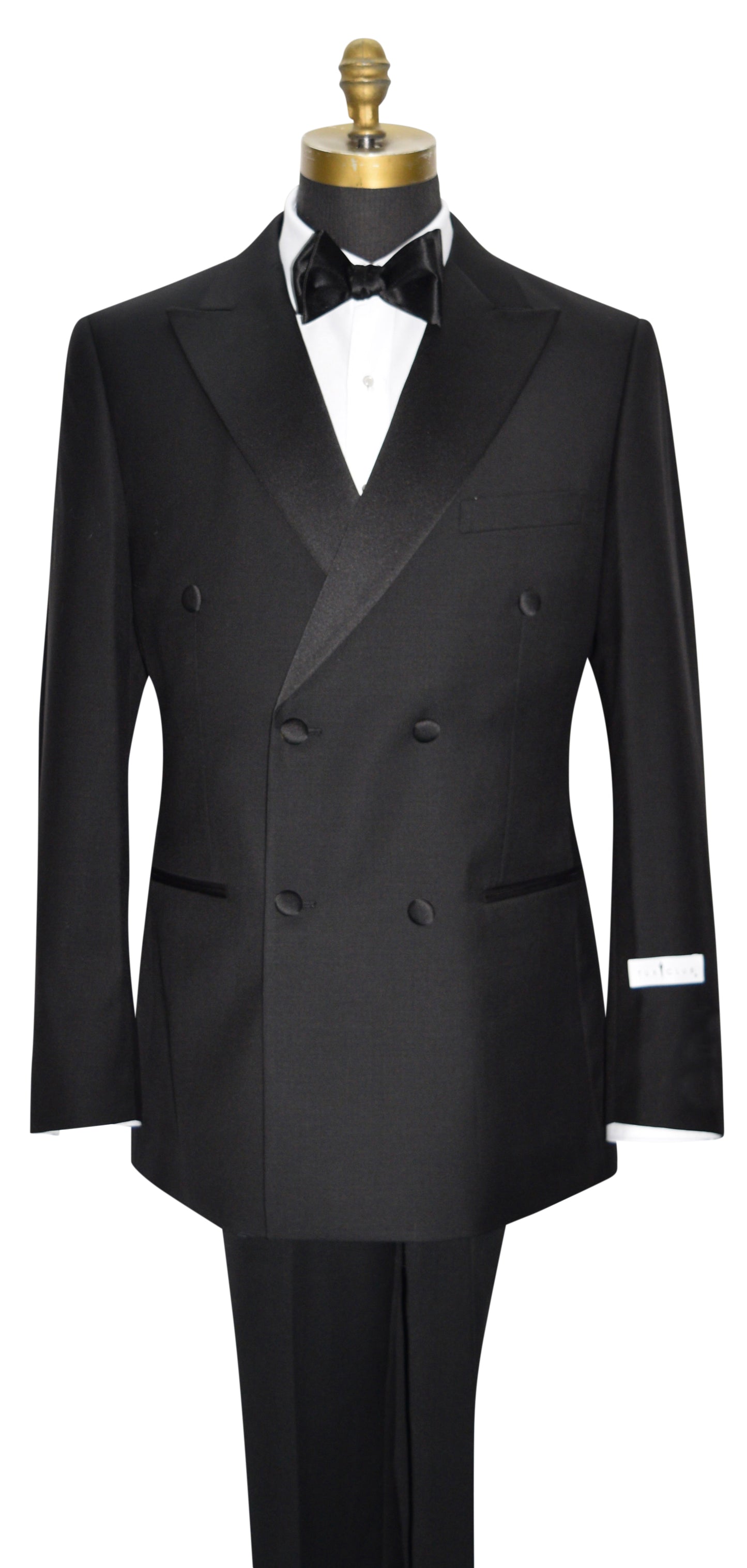 mannequin wearing a black double breasted tuxedo with a black bowtie against a white background