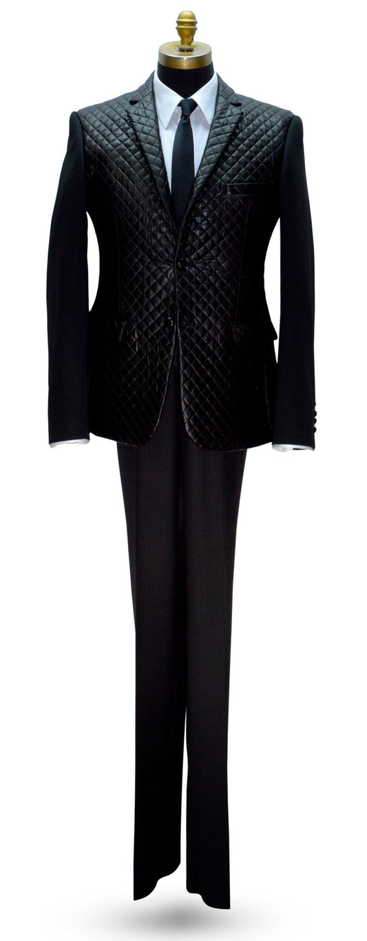 life size mannequin wearing a black tufted jacket with a white shirt and a long black skinny necktie against a white background
