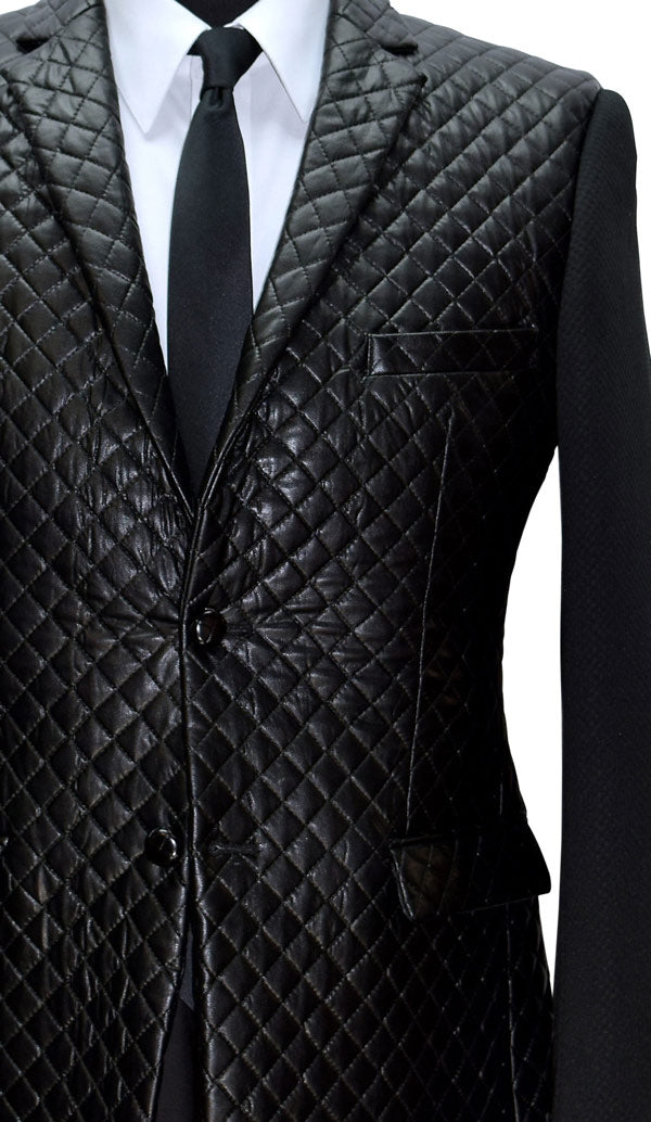 very close-up mannequin wearing a black tufted jacket with a white shirt and a long black skinny necktie against a white background