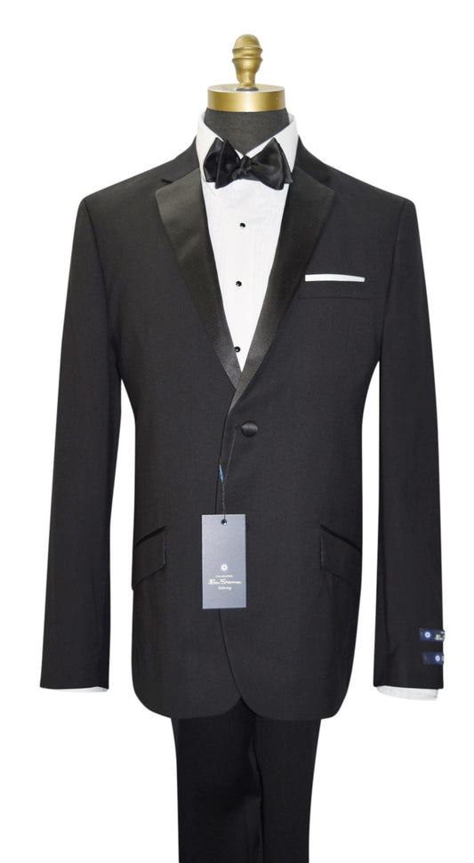 Black tuxedo with white shirt and bow tie on a mannequin against a white background