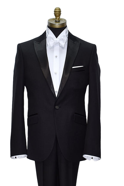mannequin wearing black peak lapel tuxedo with mother-of-pearl studs and white wing collar tuxedo shirt and a white "tie-yourself" bowtie against a white background