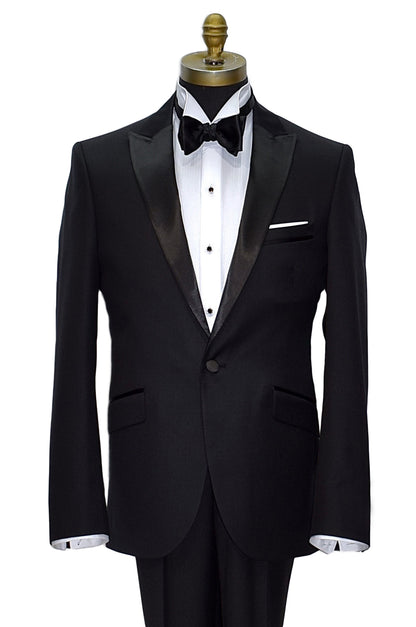 black peak lapel tuxedo wearing a white shirt and black bowtie against a white background