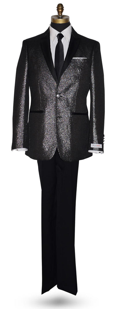 full length mannequin wearing a black peak lapel tuxedo with shimmer accessorized with long black skinny dress tie with a "Dante Inferno" branded label on the sleeve against a white background