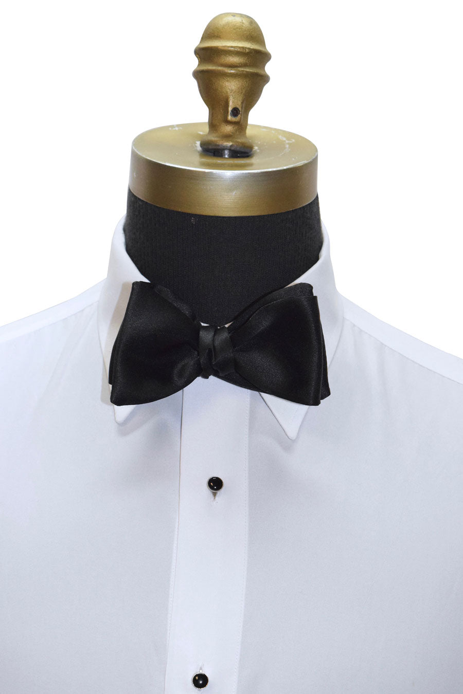 Black satin "self-tie" bow tie on a white shirt on a white background