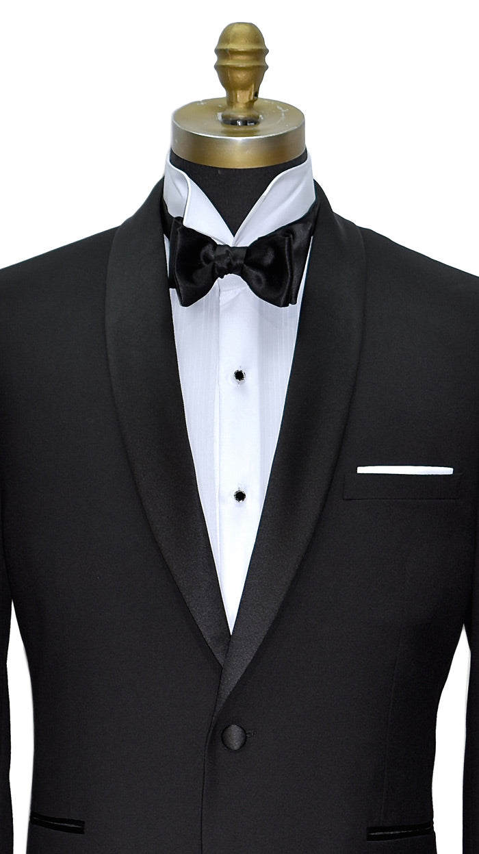 very close front view mannequin wearing a black shawl collar tuxedo with a white wing-collar tuxedo shirt and black satin bowtie on a white background