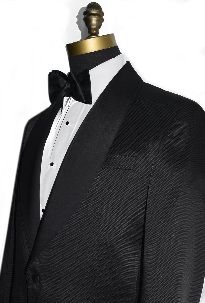 close-up size view black shawl collar tuxedo with slight texture with black satin bowtie against a white background