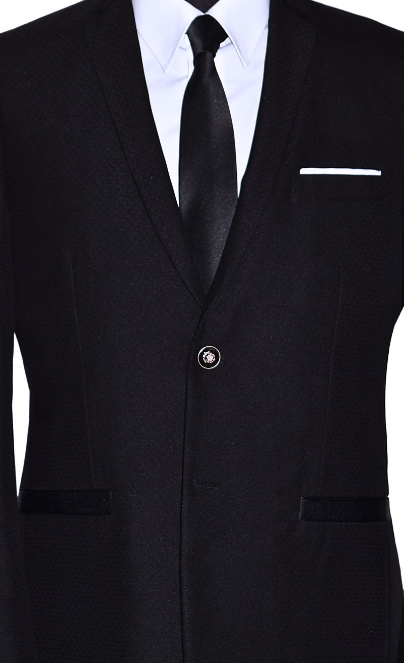 very close-up photo of mannequin wearing a black sports coat with a white dress shirt and black satin necktie with gray pants in-front of a white background