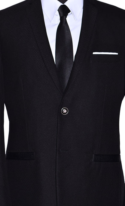very close-up photo of mannequin wearing a black sports coat with a white dress shirt and black satin necktie with gray pants in-front of a white background