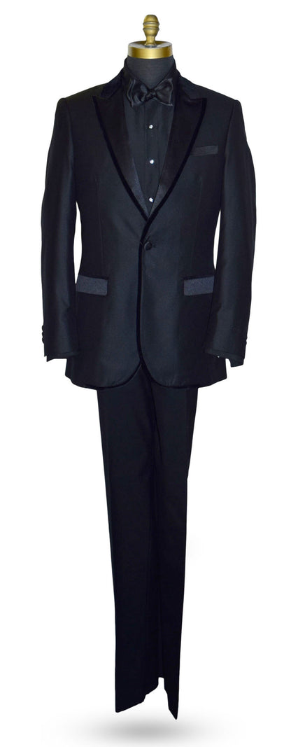 life size mannequin wearing a black peak lapel tuxedo with velvet trim on the lapel with a black tuxedo shirt and black satin tie-yourself bowtie against a white background