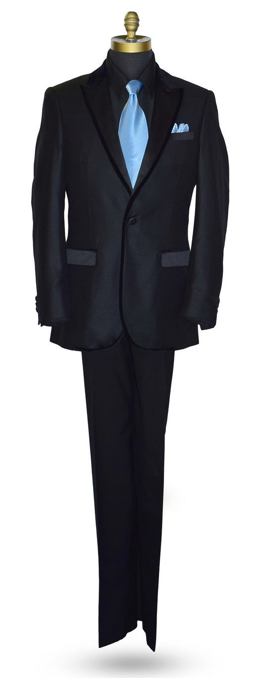 Back tuxedo jacket with a peak lapel with velvet trim on edges of lapel, shown with a blue necktie against a white background
