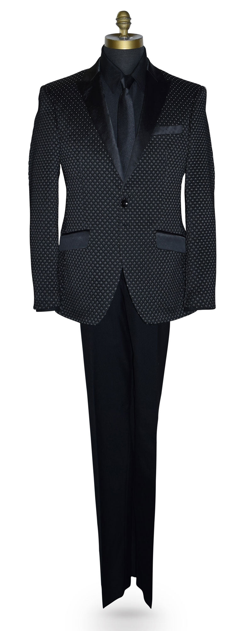 Black tuxedo with white pin-dot wearing a black tuxedo shirt and long black necktie  on a mannequin against a white background
