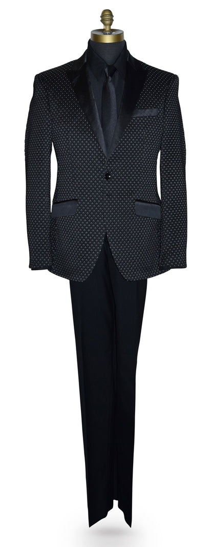 Black tuxedo with white pin-dot wearing a black tuxedo shirt and long black necktie  on a mannequin against a white background