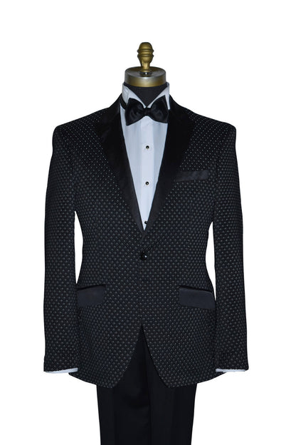 close-up Black tuxedo with white pin-dot on a mannequin against a white background