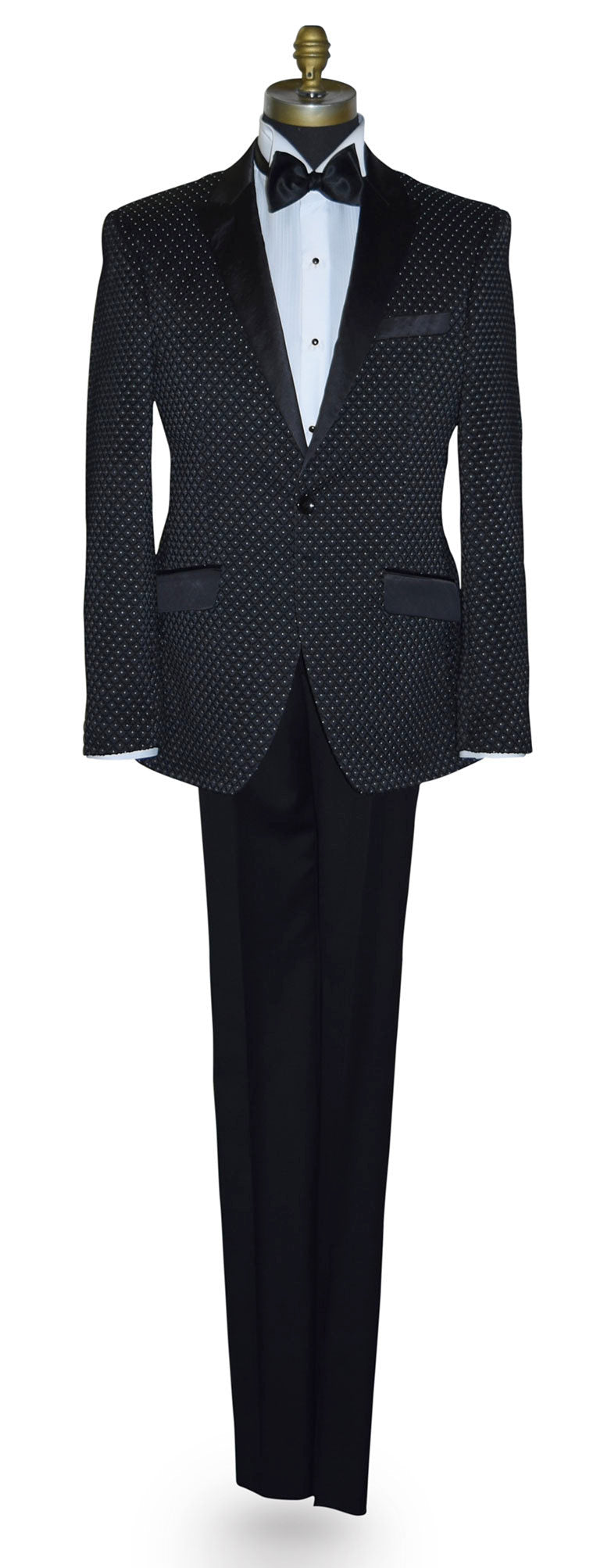 Black tuxedo with white pin-dot on a mannequin against a white background
