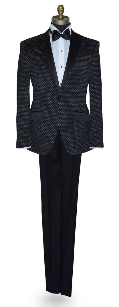 Black tuxedo with white pin-dot on a mannequin against a white background